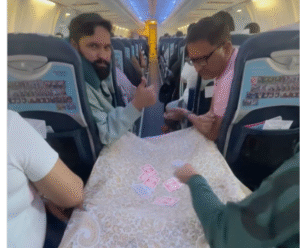 Passengers Playing Cards on Plane